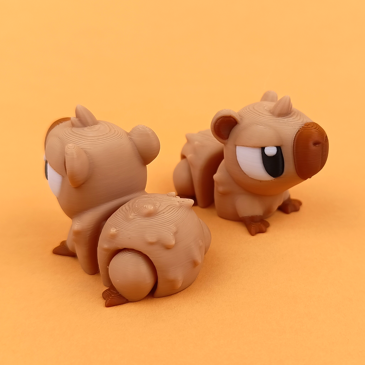 Baby Capybara — one included in this bundle; colours may vary