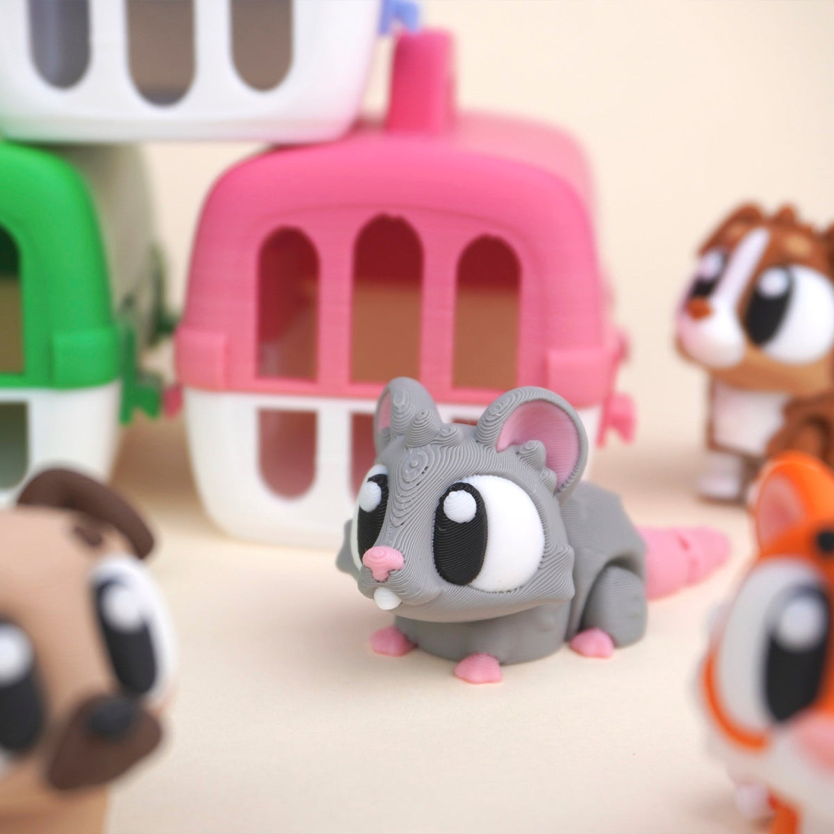 Pink and green carriers with mouse, cat, pug, puppy and chameleon, illustrative product image Style illustration; Mini dimensions not shown to scale.