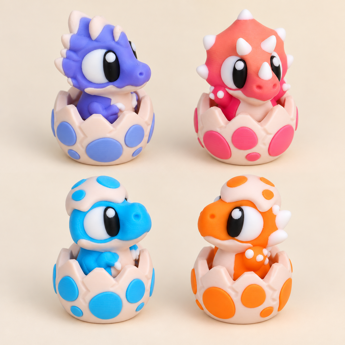 Composite group image: four different assembled dinosaur egg clickers, one of each design.