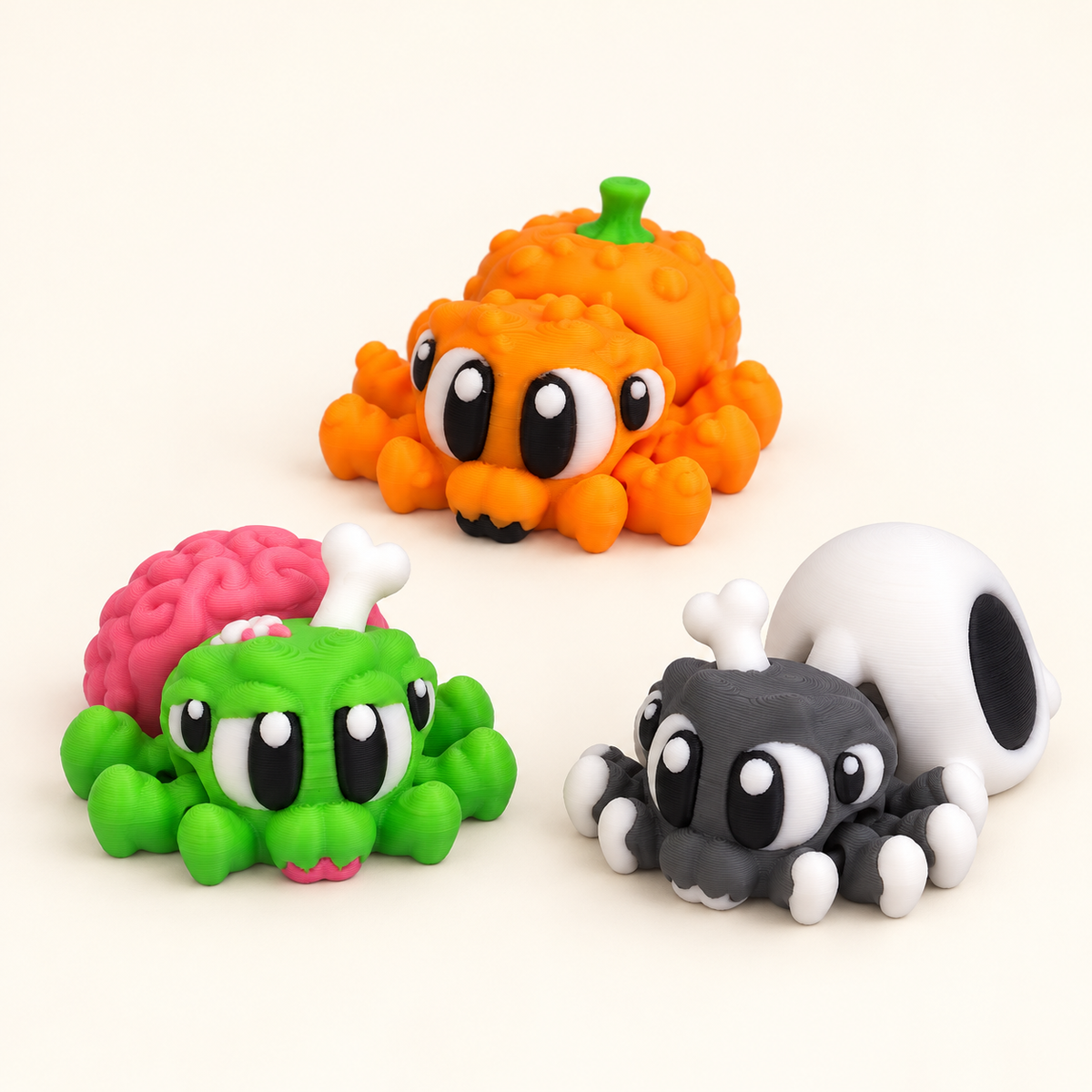 Composite group image: one Pumpkin Spider, one Zombie Spider and one Skull Spider. Three figures included.